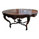 Antique 19th century Spanish walnut oval table on wheels