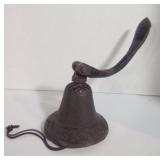 Vintage Cast Iron Farm Bell with Ornate Design.