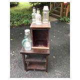 Sm. Table, antique wood cabinet, antique bottles  Sm. Table, antique wood cabinet, antique bottles