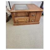 Hard wood coffee table with multiple drawers and glass top 