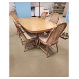Large wooden dining room table with 6 chairs 