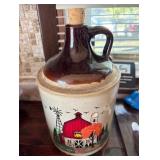 Large ceramic moonshine jug with hand, painted barn