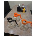 2 decaf coffee pots and one regular pot