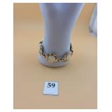 Gold bracelet with white insets