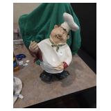 Chef figurehold bottle of wine