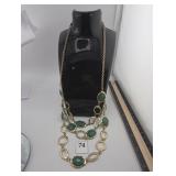 Gold chain with green insets