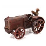 Lot 498 Cast Iron Mechanical Tractor Toy with Driver