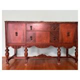 Antique Buffet with Ornate Carvings and Brass Pulls