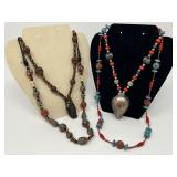 Group of Four Tibetan Beaded Necklaces with Ornate Metal Pendants
