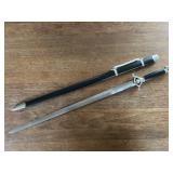 Decorative Sword with Ornate Hilt and Black Sheath