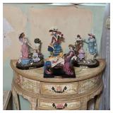 Victornia accent table with vintage figurines