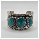 Vintage Native American sterling silver and turquoise Lorenzo James cuff bracelet