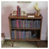 Mid century modern bookshelf and books