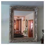 Ornate silver wall mirror