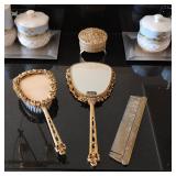 Vintage ornate vanity mirror and brush set