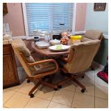 Vintage dining table with caster chairs