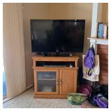 LG LED HD TV, Sauder oak TV stand, JVC VHS tape player, Toshiba DVD player
