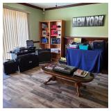 Music and audio setup with guitar amps, recording/mixing unit, turntable, and related equipment.