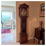 Gorgeous warm wood grandmother clock - good working condition, keeps accurate time, and chimes