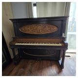Antique Upright Piano with Ornate Carved Panel