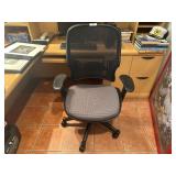 Ergonomic mesh back swivel office chair.