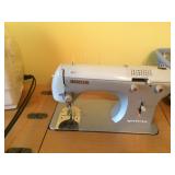 Sewing machine with cabinet