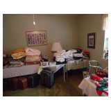 sheets blankets  and suitcases