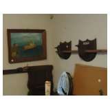 gun rack  and nautical painting