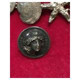 Pin made out of  old dime