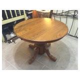 Round table has two matching chairs