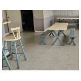 Yellow and green picnic tables and benches