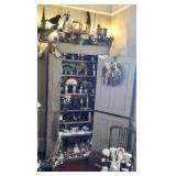 Cabinet full of pewter and Christmas houses