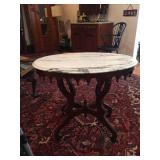 Oval table with marble top