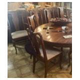 Queen Ann round table has leaves and 8 matching chairs