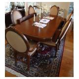 Size 80" x 45" with two 15" leaves 2 captains chairs and 4 reg. chairs