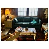 Green vinyl couch, has cracking vinyl on one arm