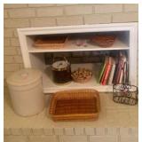 Covered crock, basket, books