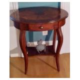 Oval table with drawer
