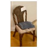 One of four wicker chairs