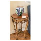 Round inlayed table with claw feet