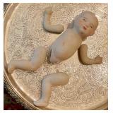 Porcelain doll needs restringing