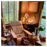 Lamps chairs and books in the office