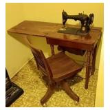 Singer sewing machine in stand, swivel desk chair