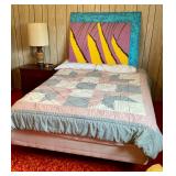 Double mattress on bed frame, large painting