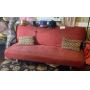 Red sofa folds back into a bed