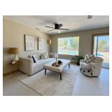 Sofa, coffee table, rug, matching accent chair, lamps and wall art