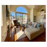 Sofas, throw pillows, rugs, faux plants, wall art
