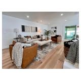 Leather club chair, upholstered coffee table, throw pillows, ivory sofa, canvas art, floor lamp