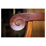 Hand-carved curls and arms (detail)