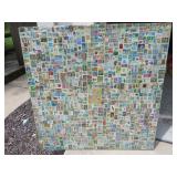 VINTAGE STAMP COLLECTION / TABLE TOP MOUNTED ON BOARD WITH GLASS